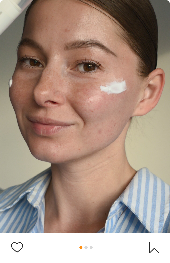 Girl smiles at camera with streaks of Eczemact Cream on her cheeks